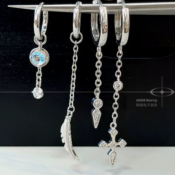 Asymmetrical hoop earrings for women, featuring feather, moonstone, and diamond-encrusted cross pendants, trendy and stylish, with a high-end and luxurious feel, popular among influencers