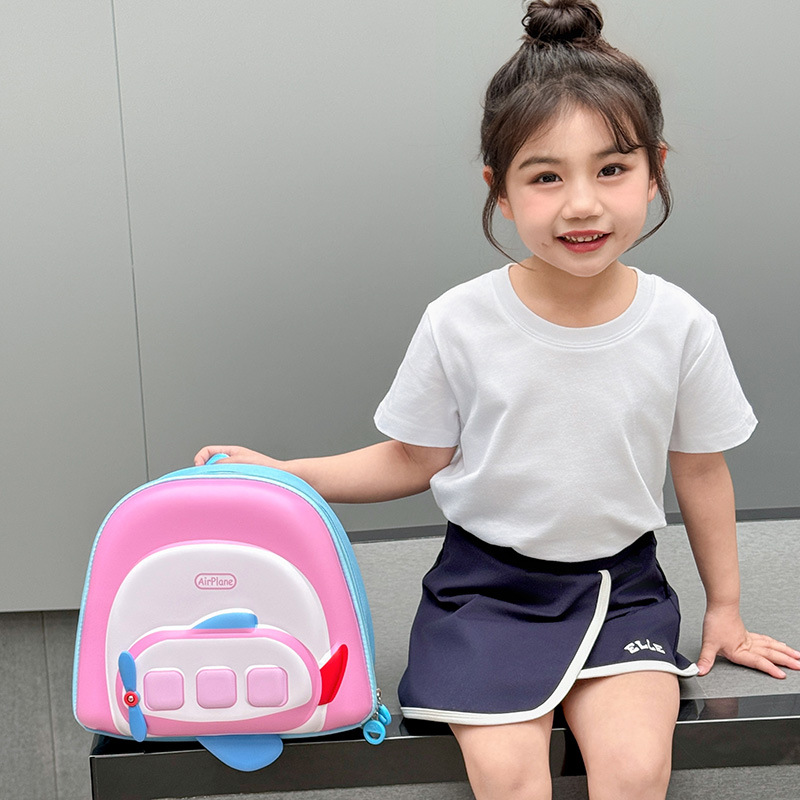Jardín de infantes mochila para bebés lindo pequeño avión ligero cáscara de huevo mochila para niños y niñas nueva mochila infantil transfronteriza