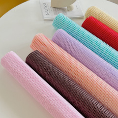 Bright-colored grid-patterned floral lining for flower bouquets—matching inner and outer wraps, ideal for bouquet packaging, florist supplies, and wholesale flower shop needs.