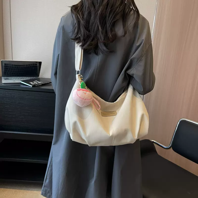 简约纯色上课通勤包新款高级质感大容量饺子包时尚百搭帆布斜挎包