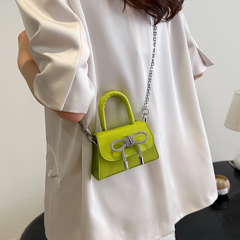 Moda al por mayor arco mini bolso mujer 2025 nuevo mochila bolso de hombro universal bolso de moda mujer