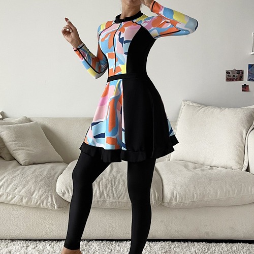 Muslim swimwear with random graphic prints: conservative, full-coverage three-piece set featuring long-sleeve one-piece tops and long pants with shorts.