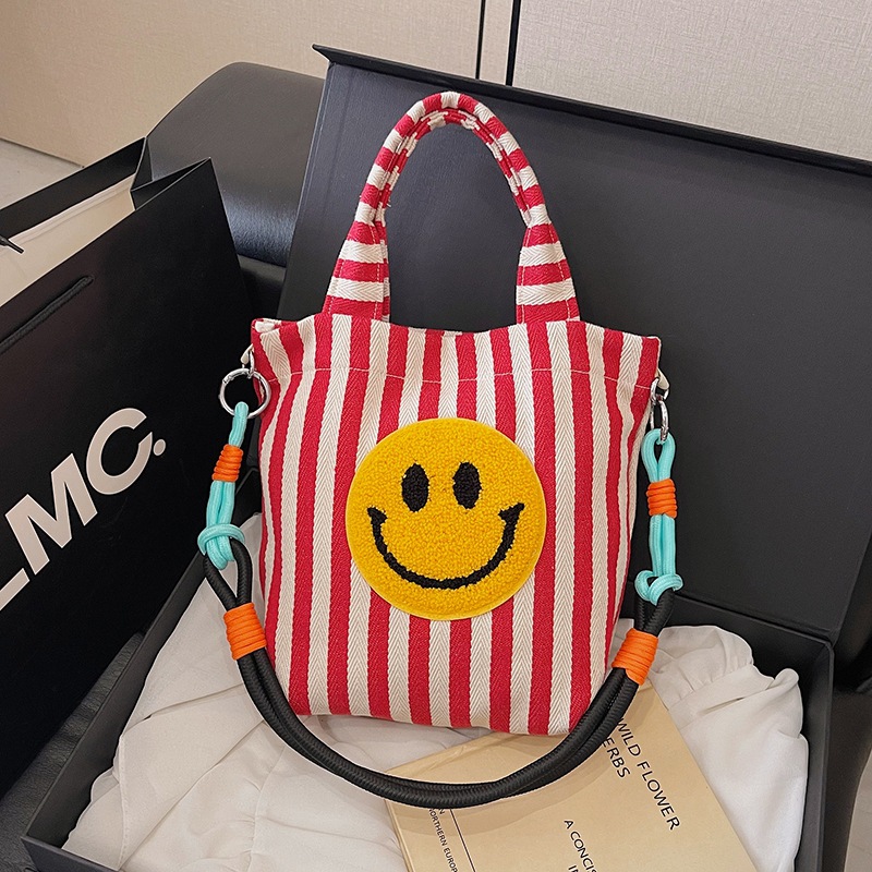 Bolso de moda coreana 2025 nuevo bolso estilo estilo universitario bolso de hombro a rayas lindo sonriente bolso de mensajero mujer