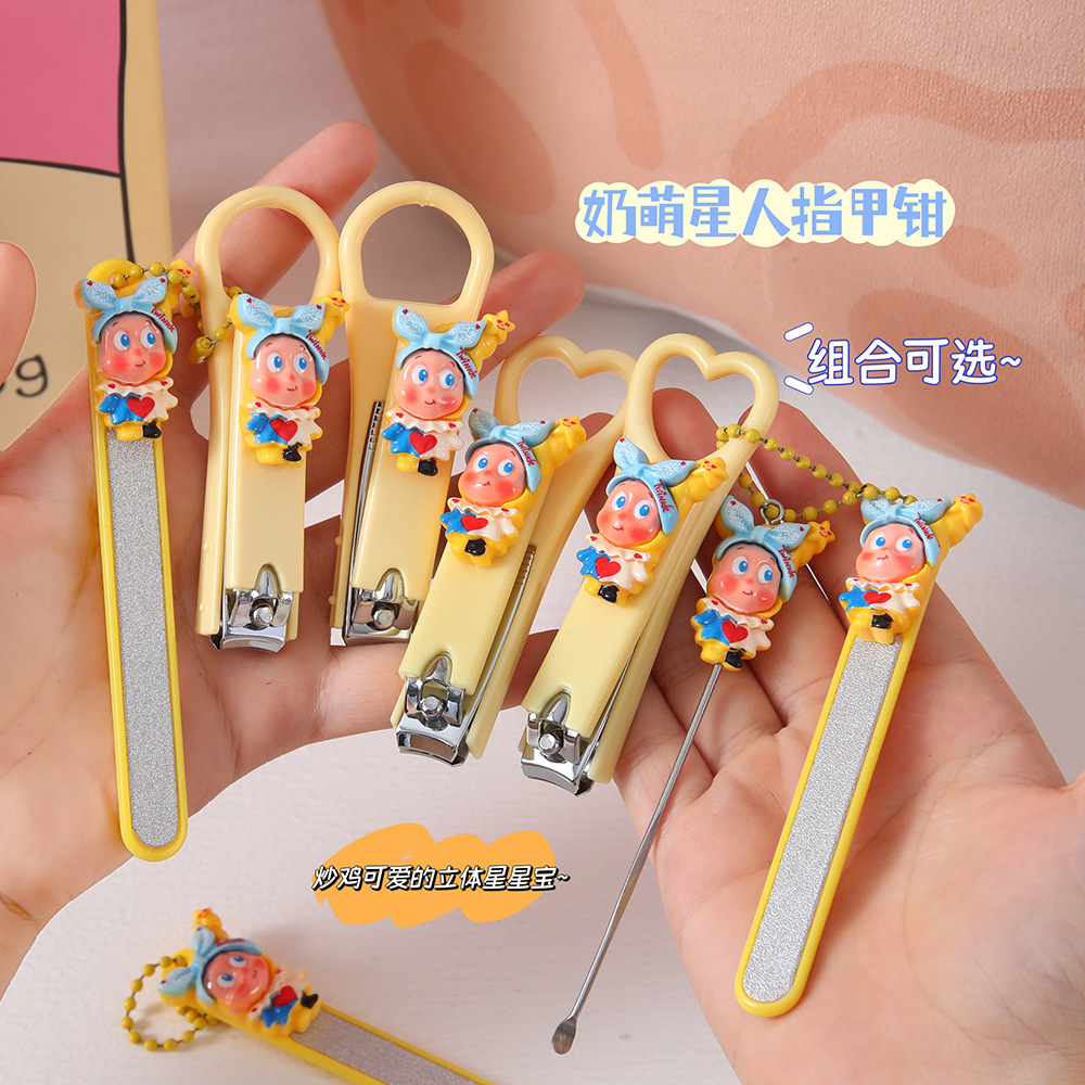 Cute cartoon star-shaped nail clippers with an ear pick and nail file set, in a creamy color scheme, and designed for easy portability