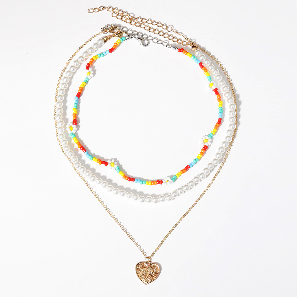 New Multi-layer Stacking Daisy Rice Beads Heart-shaped Embossed Pearl Necklace Wholesale display picture 5