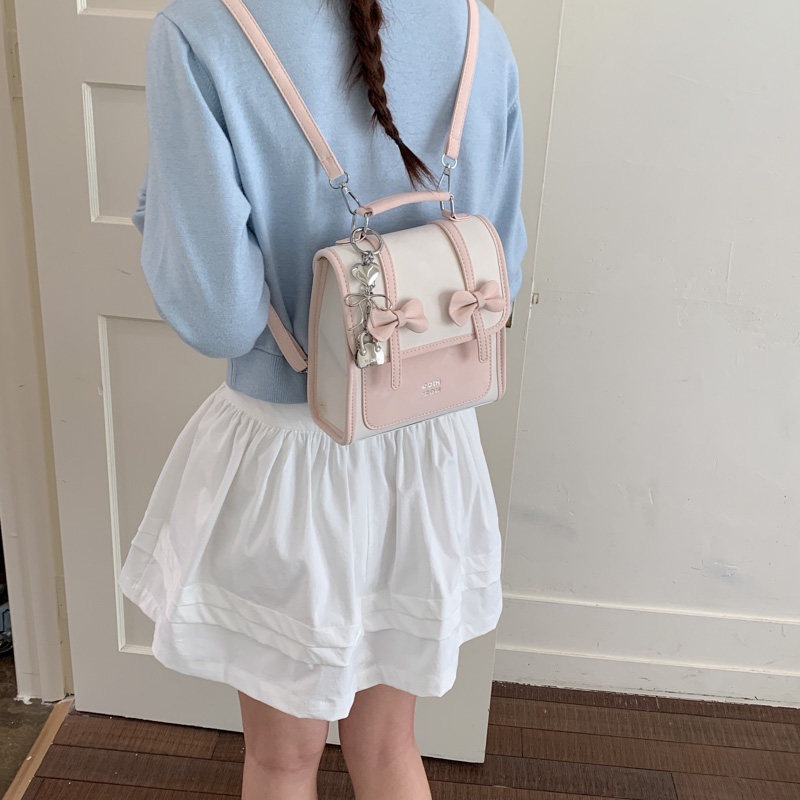 Mochila de temperamento de viaje femenino 2026 de alto valor de cara simple coreana mochila de viaje nuevo arco bolso pequeño