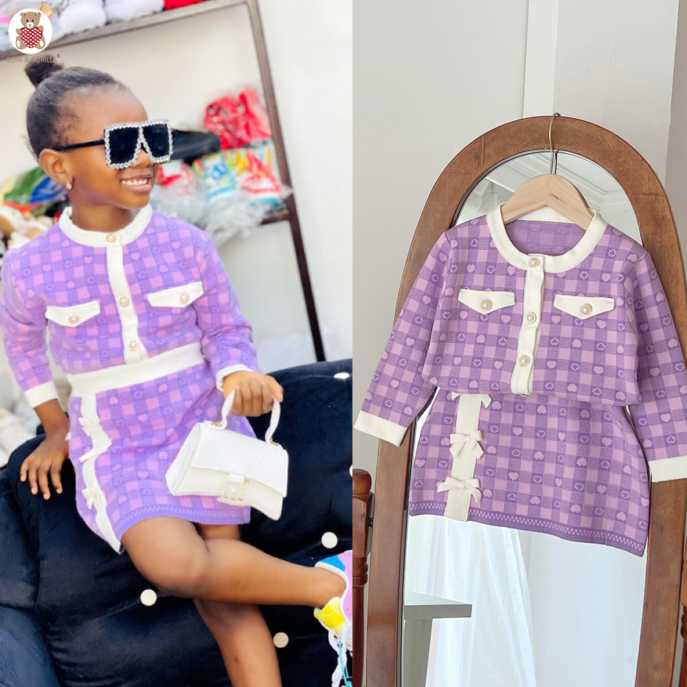 JINYONG Koreansk utgåva Love Knitwear Flickkjol med rosett och omlott, liten och medelstor, barnmodell, tvådelat set_voghion.com
