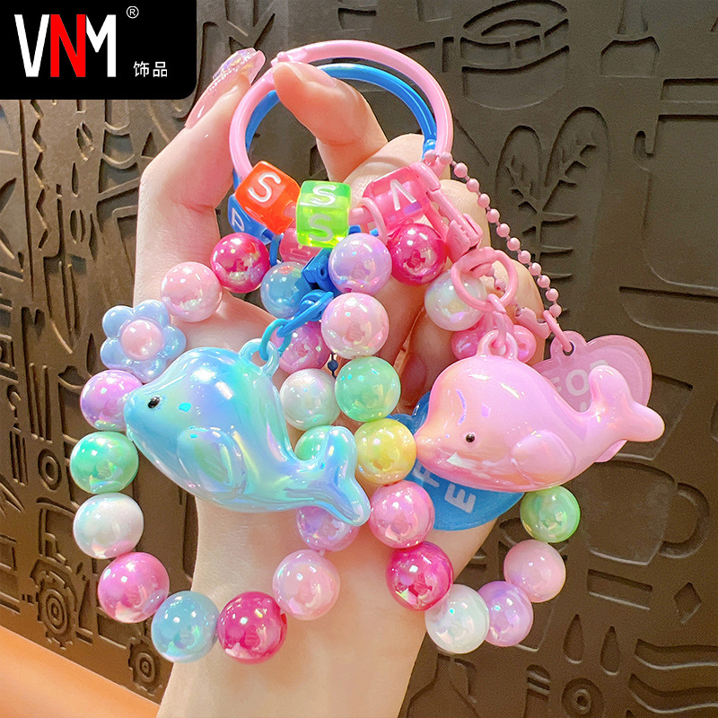 Acrílico galvanizado delfín llavero colgante fresco colorido par de cuentas bolsa adornos regalo al por mayor