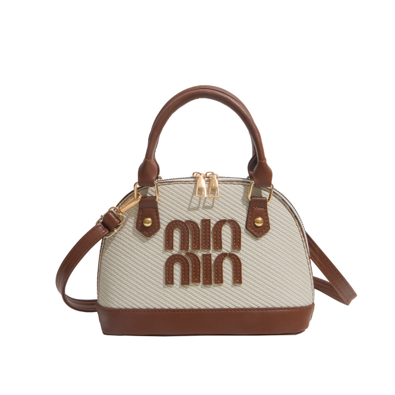 Tendencia transfronteriza coreana bolso de mano conchas bolso de mujer 2026 primavera nuevo empalme color bolso de hombro bolso de viaje