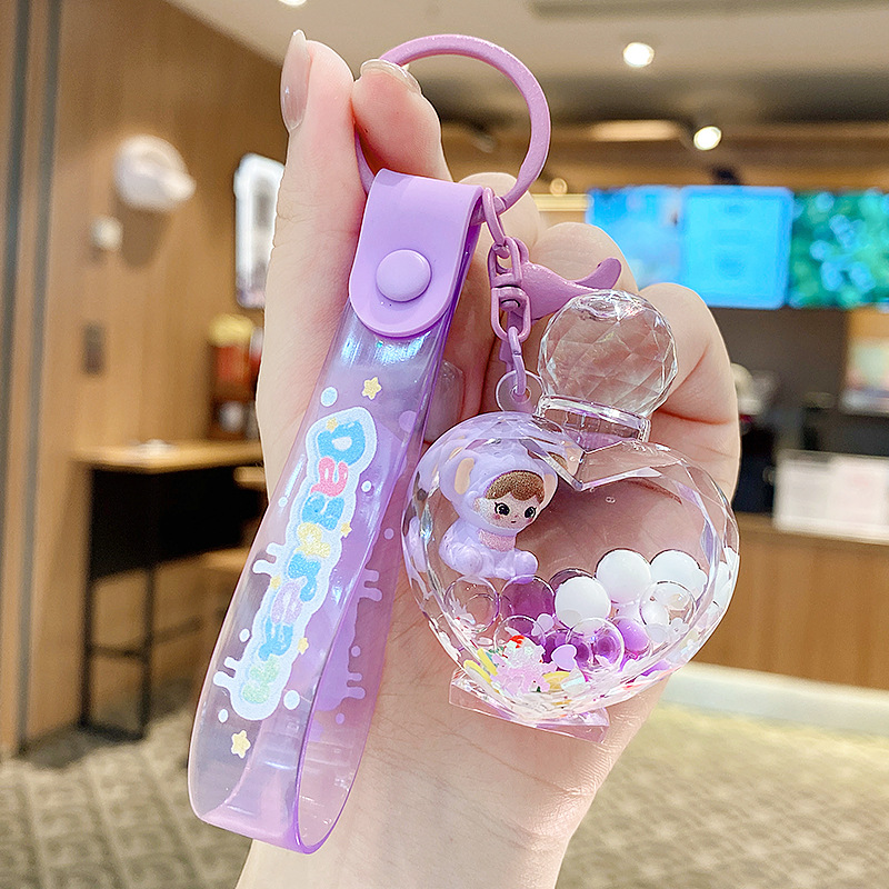 Muñeca de elefante morado-botella de perfume