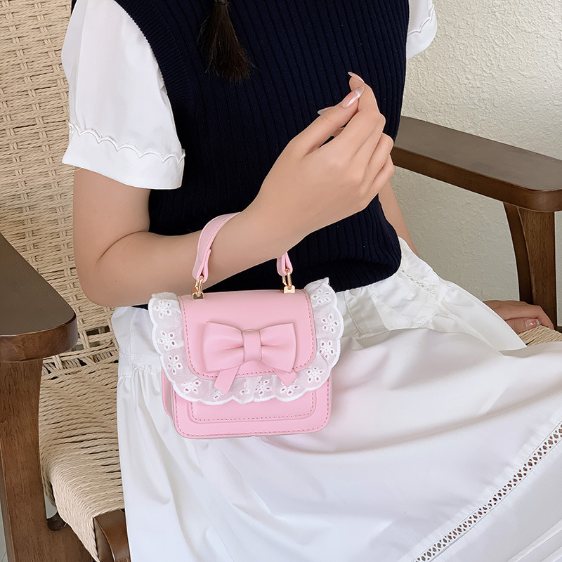 Bolsos de hombro de encaje extranjero para hombres y mujeres, bolsas de cadena de arco mini lindas coreanas nuevas bolsas para niños