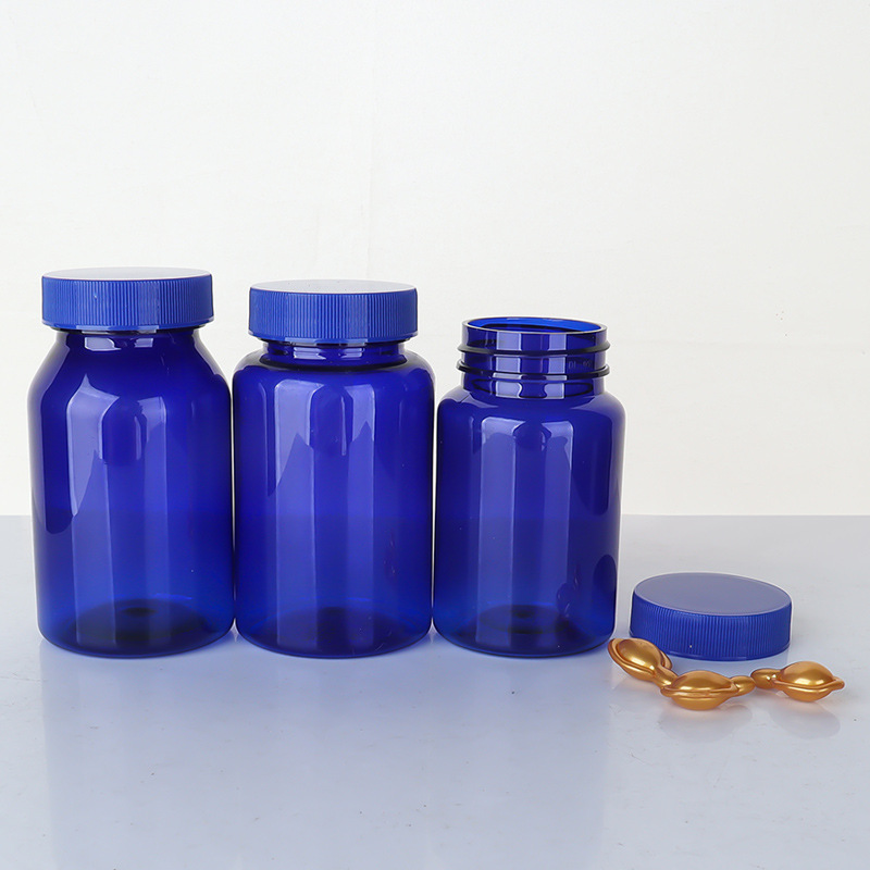Botella de plástico azul 80–150 ml con tapa estriada, envase para suplementos o cápsulas.