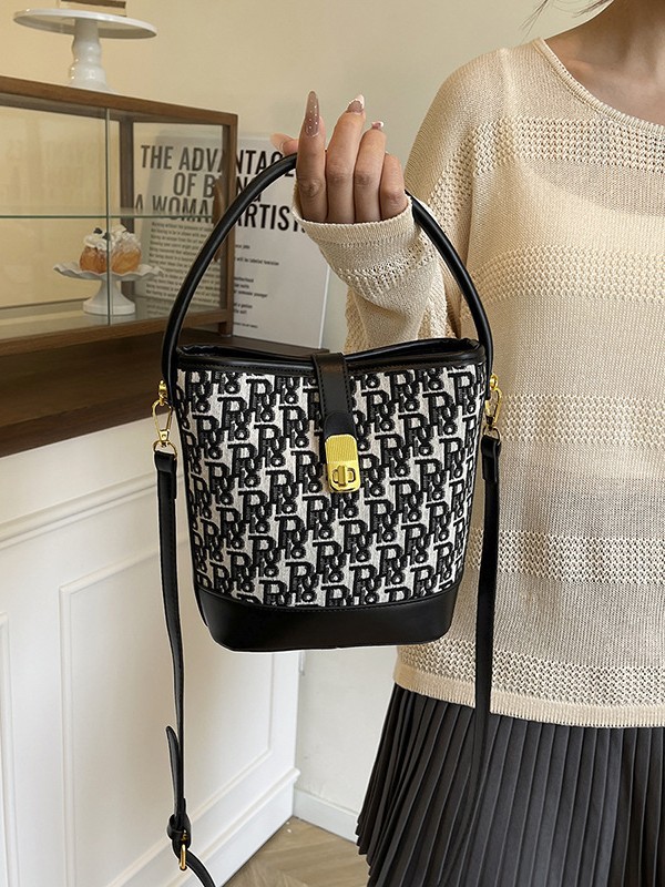 Bolso de mano exquisito de alta gama para mujer 2025 nuevo bolso de cubo retro con estampado de tela bolsa de mensajero de un solo hombro de nicho