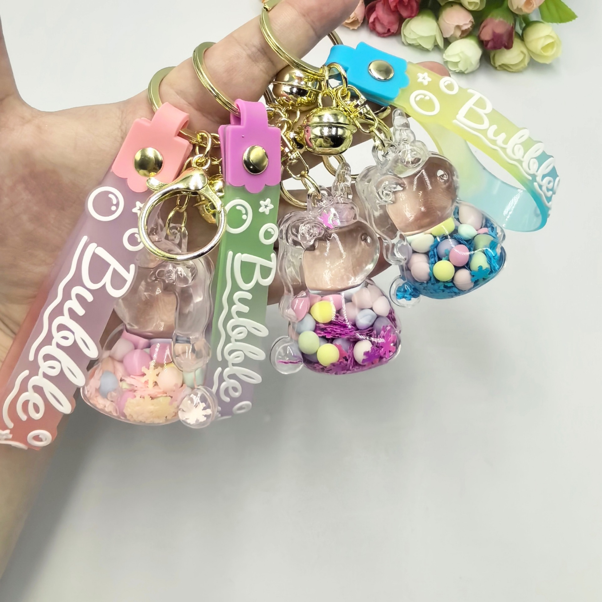 Aceite de copo de nieve azúcar colorido frijoles unicornio llavero colgante bolsas colgantes bolsas colgantes regalo creativo para estudiantes