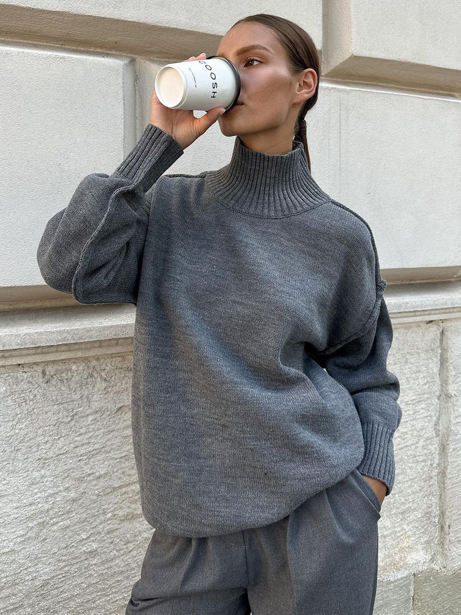 Suéter de cuello alto con costuras transfronterizas para mujer, otoño e invierno europeo y americano nuevo estilo casual suelto perezoso suéter grueso suéter de punto