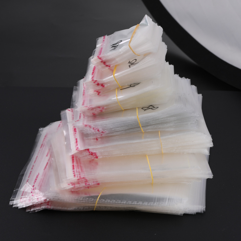 Accesorios de joyería de bricolaje bolsa de material bolsa opp bolsa de embalaje de plástico transparente bolsa de ropa bolsa autoadhesiva accesorios