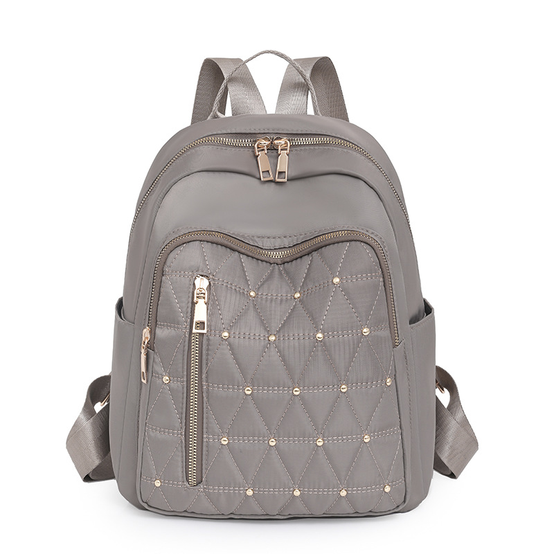 Mochila de nailon bordada de rombo para mujer 2024 nuevo estilo casual para mujer mochila de viaje ligero para viajeros urbanos