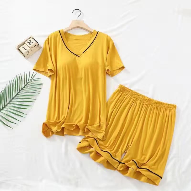 Pijamas de verano Pantalones cortos de manga corta para mujer con almohadilla en el pecho color sólido Delgado dulce suelto desgaste exterior simple traje de desgaste para el hogar