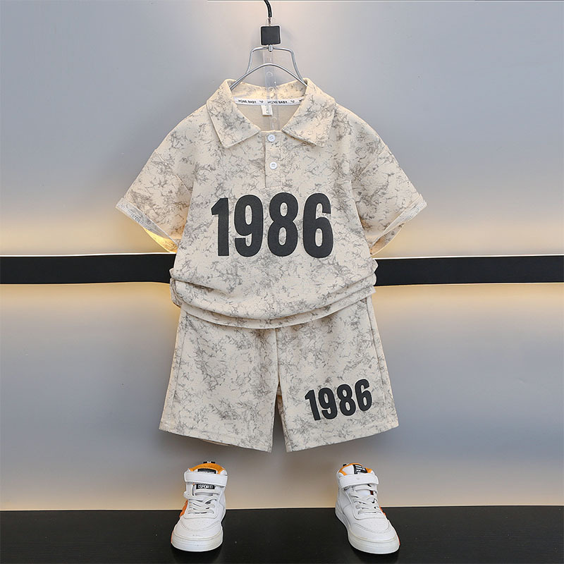 7189 ropa de verano para niños 2025 nuevo traje deportivo de camisa polo para niños de manga corta para niños de mediana edad y grandes
