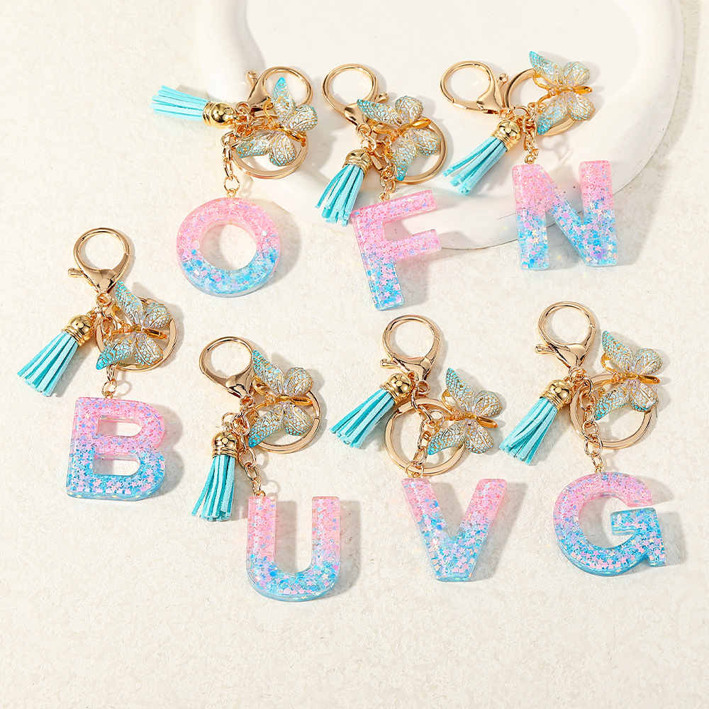 Europa y los Estados Unidos transfronterizos nuevos cristal sequinado goteo de goma letras inglesas joyería llavero y bolsos colgante apoyo al por mayor