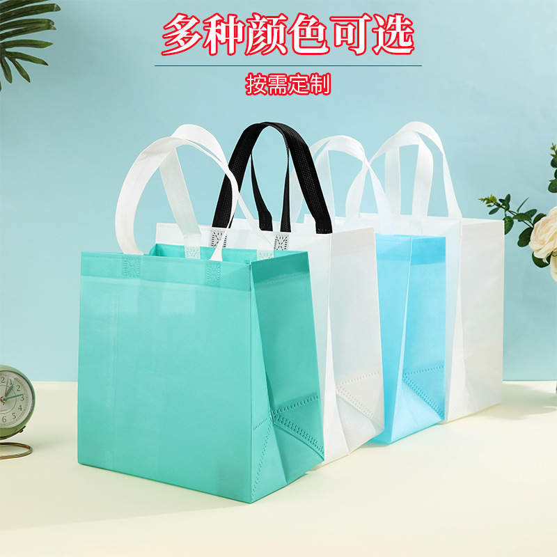 En stock bolso no tejido recubierto al por mayor bolsa de protección del medio ambiente bolsa de tienda de ropa bolso de compras engrosado logotipo imprimible