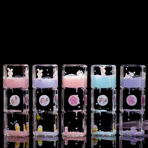 Geometric three-square cartoon rabbit enters oil and drops children's hourglass toy as a creative birthday gift for classmates