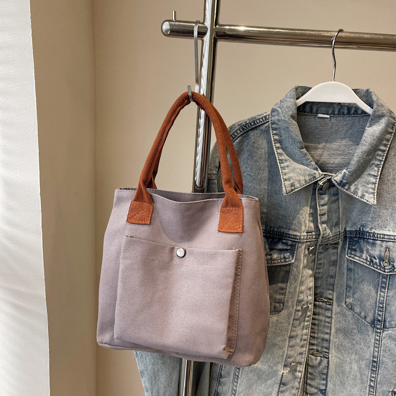 2024 nuevo bolso de lona para mujeres tela japonesa retro simple versátil Harajuku bolso de mano de color sólido casual de moda para mujeres