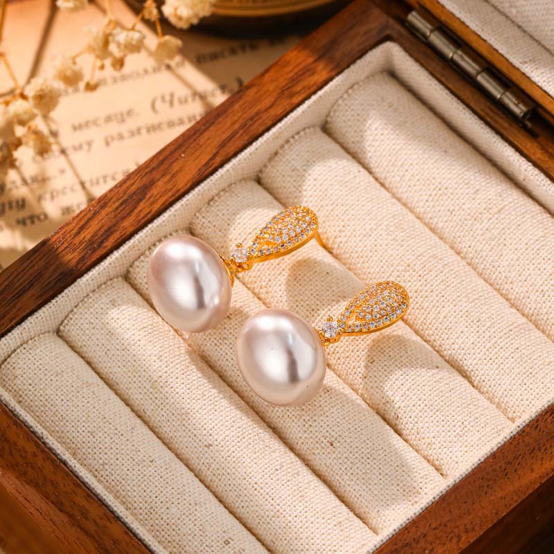 Elegant earrings with zircon drop-shaped from pearl