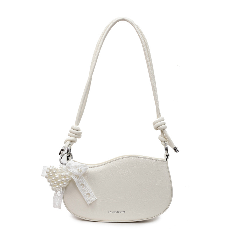 Bolsos pequeños de alta calidad 2025 verano nuevo estilo bolso femenino diseño de nicho bolso de hombro moda patrón de agarre de mano bolso de mensajero