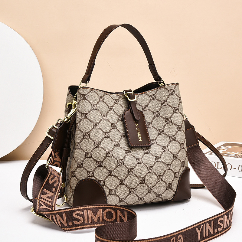 Bolsos bolsos de mujer bolsos de moda retro 2025 bolsos de nuevo estilo de gran capacidad y sentido de alta calidad bolso de cubo diagonal de un solo hombro mujeres