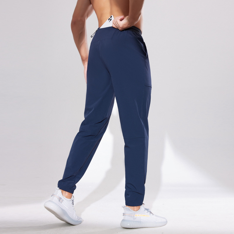Pantalones deportivos Otoño de los hombres al aire libre de secado rápido pantalones sueltos de nylon tejidos tobillo atado pantalones casuales fitness correr Pantalones