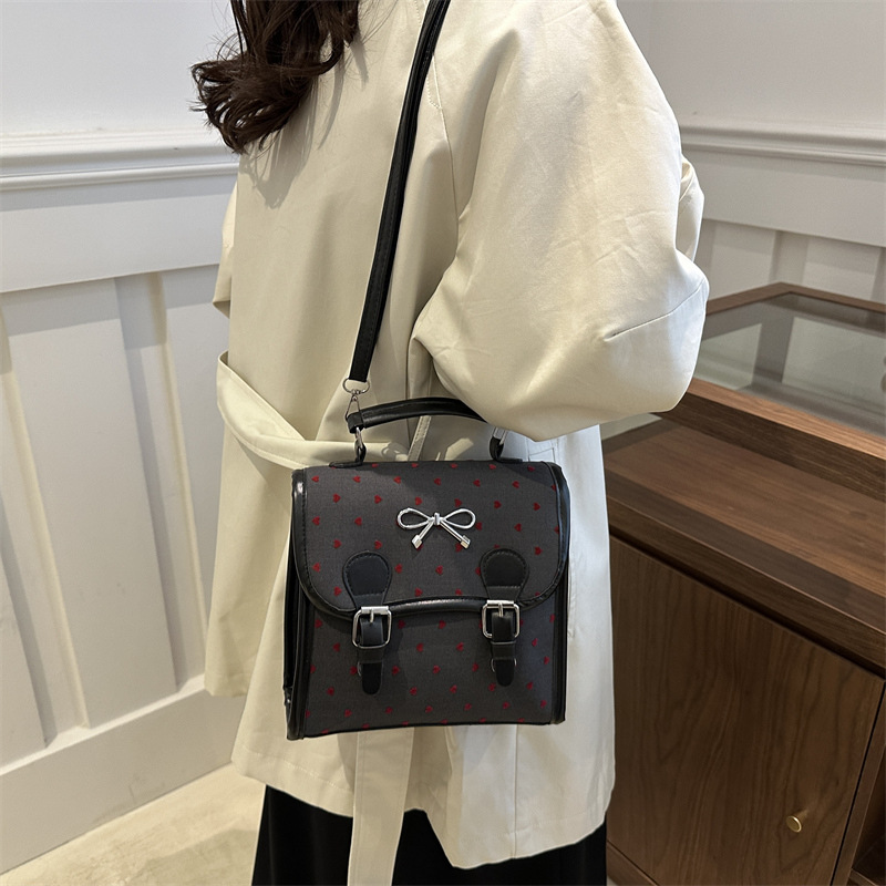 Bolsas casuales populares de este año para mujeres 2024 nueva moda vertical estilo de moda universal doble arco mochila