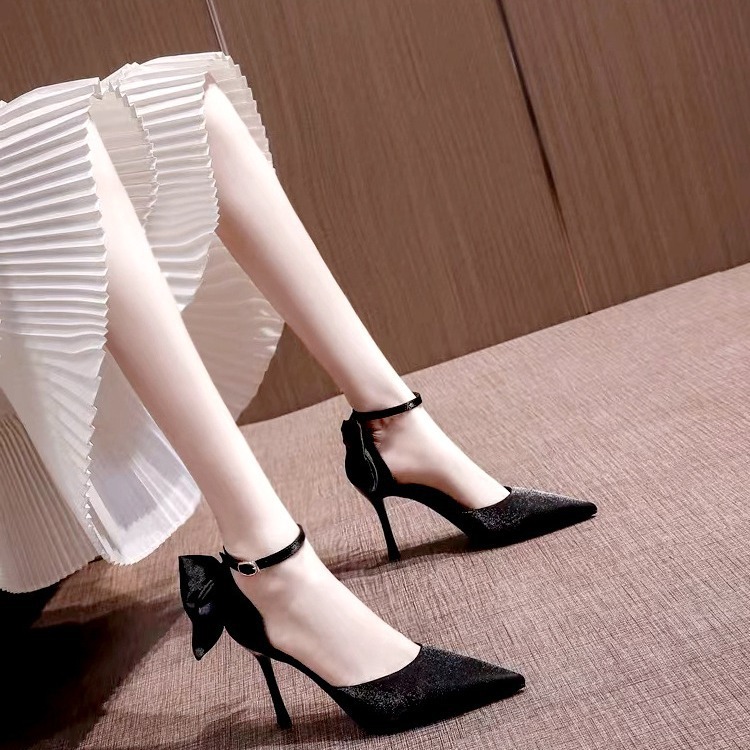 White wedding shoes with a strap made of satin for bride