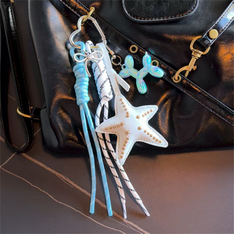 Transición fronteriza Miu Tie Wind Keychain original coreano hecho en casa colgante de arco de viento lindo fabricante de cuerda tejida a mano