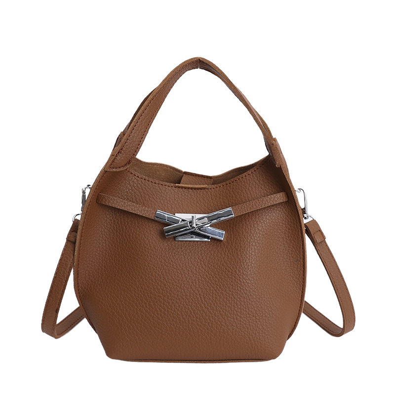 Bolso de mujer nuevo estilo coreano nicho de moda lichi bolso de cubo portátil de alta sensación de ocio mochila de viaje