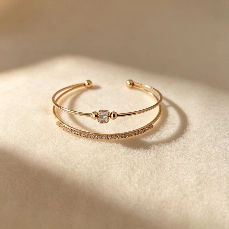 New cross-border bracelet with a zirconia open design, vacuum-plated with 14K gold, waterproof, and resistant to fading – a European and American style jewelry piece New cross-border bracelet with a zirconia open design, vacuum-plated with 14K gold, waterproof, and resistant to fading – a European and American style jewelry piece