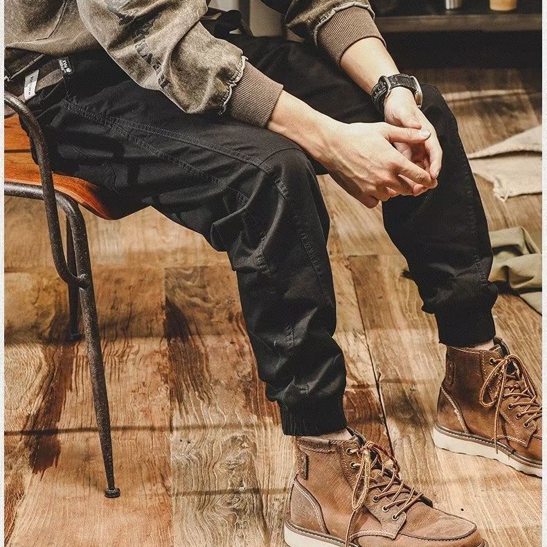 Pantalones casuales para hombres Primavera y otoño Nueva marca de moda coreana suelta más pantalones atados al tobillo pantalones al aire libre con volantes pantalones harén guapos en stock al por mayor