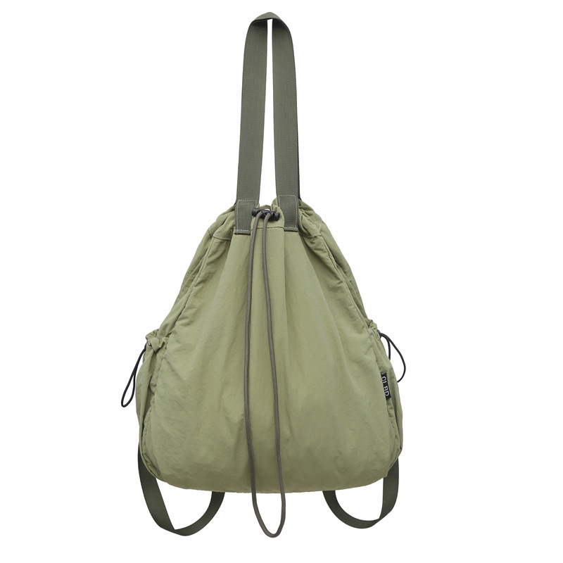 Mochila de nailon con cordón para mujer 2024 nuevo bolso de cubo de doble uso de un solo hombro literario simple para estudiantes universitarios