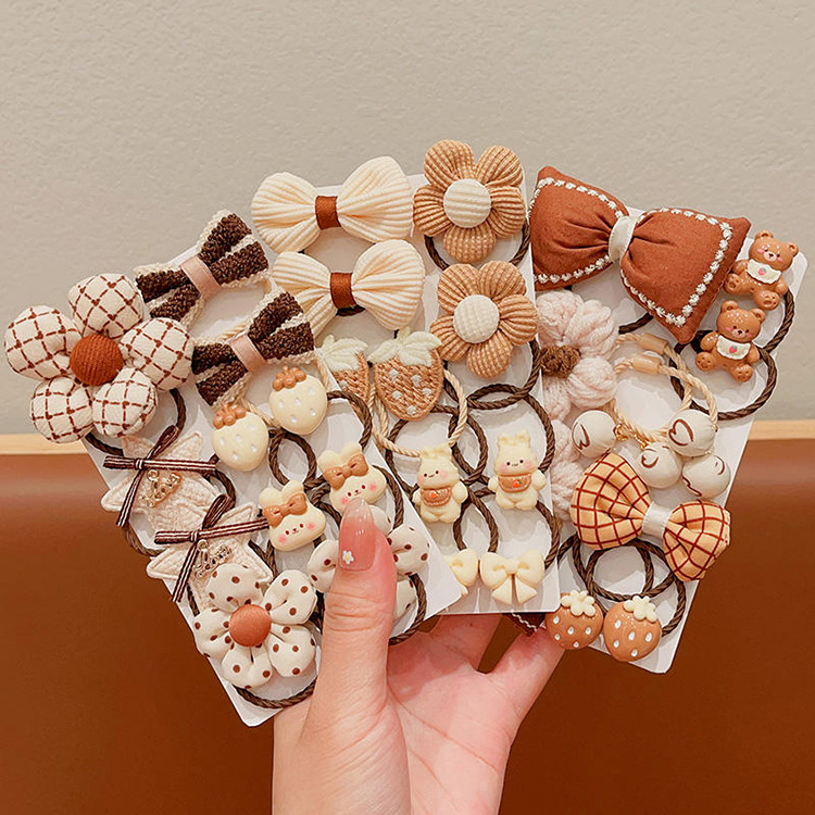 La banda de goma de la flor marrón de la leche de las muchachas de la venda de los niños no lastima el pelo banda elástica alta del pelo de la cola de caballo