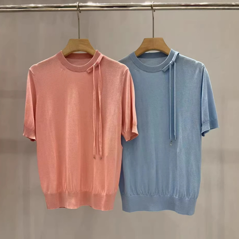 Summer knitted silk sweater with bow with a round collar