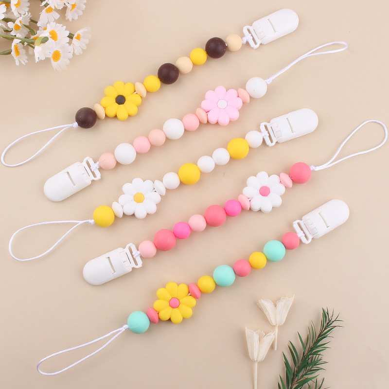 Productos para bebés Clip de chupete de plástico de bricolaje para bebés Creativo para bebés Little Daisy Silicona Mouth Pezones anti-caída de la cadena