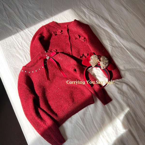 Demi-season children's red knitted sweater with bow with a round…