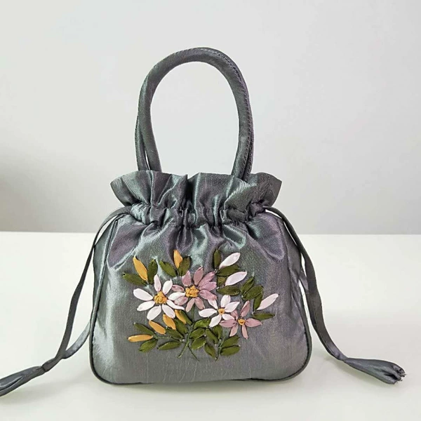 Gray drawing string embroidered bag