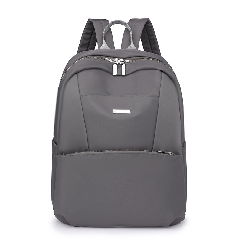 Mochila para computadora de 14 pulgadas de gran capacidad 2024 nueva mochila de viaje ligera de nailon casual mochila escolar simple de color sólido