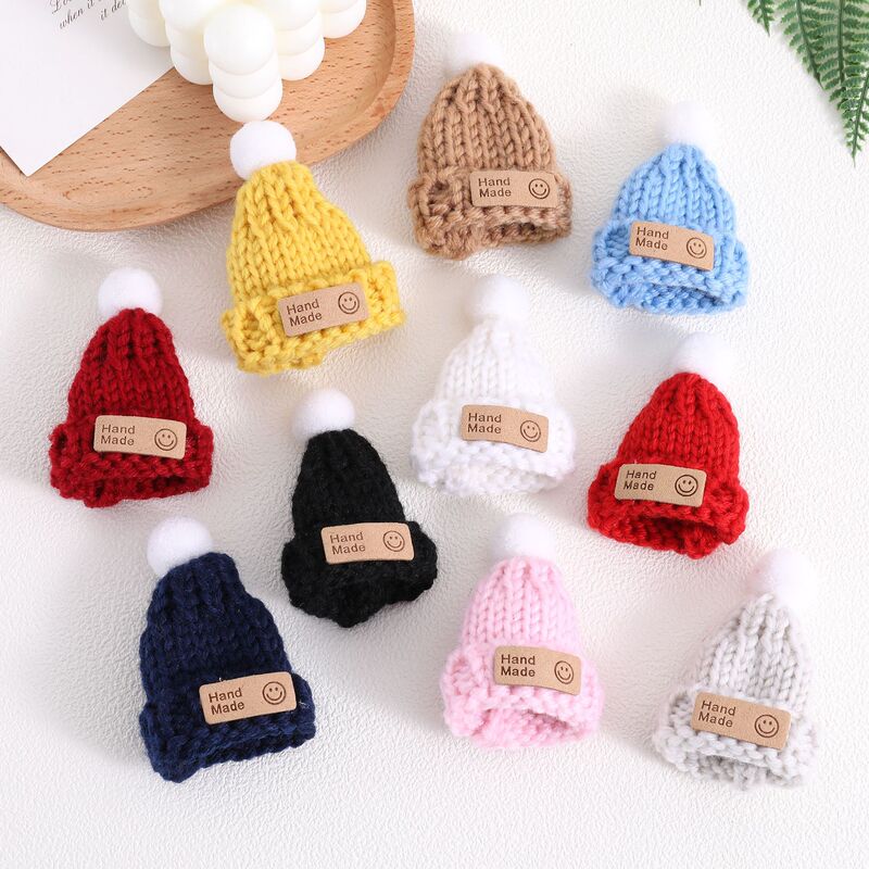 Cute mini knitted wool hat with smiley face patch and pom-pom, DIY doll and toy decoration accessories, wholesale