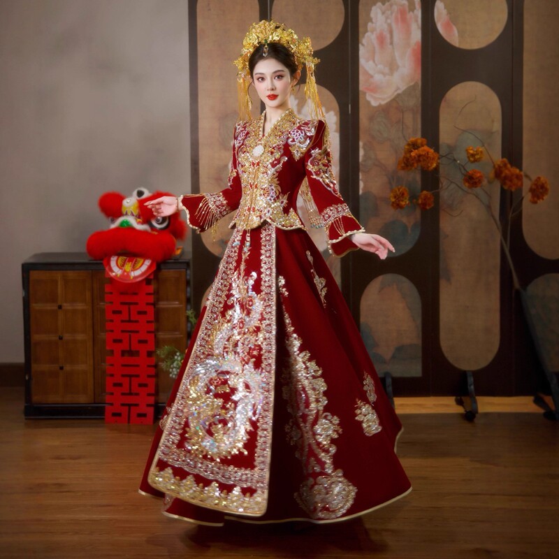 The Bride's Wedding Attire: a Slim-Fitting, Luxurious Traditional Chinese Wedding Dress, a Phoenix Crown and Veil, and a Bridal Gown. Jinxi The Bride's Wedding Attire: a Slim-Fitting, Luxurious Traditional Chinese Wedding Dress, a Phoenix Crown and Veil, and a Bridal Gown. Jinxi