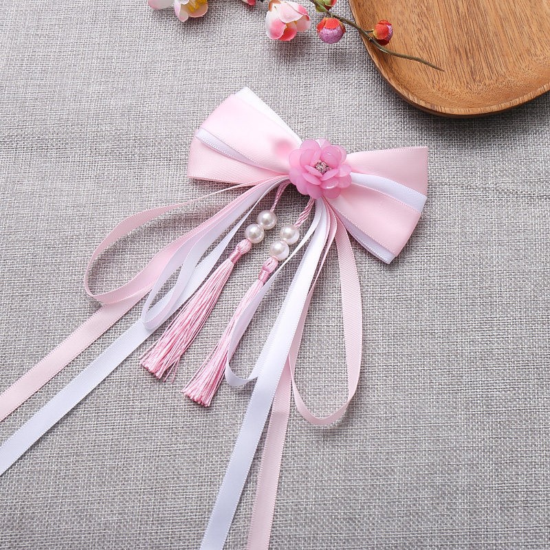 Fuchsia hairgrip flower-shaped with bow