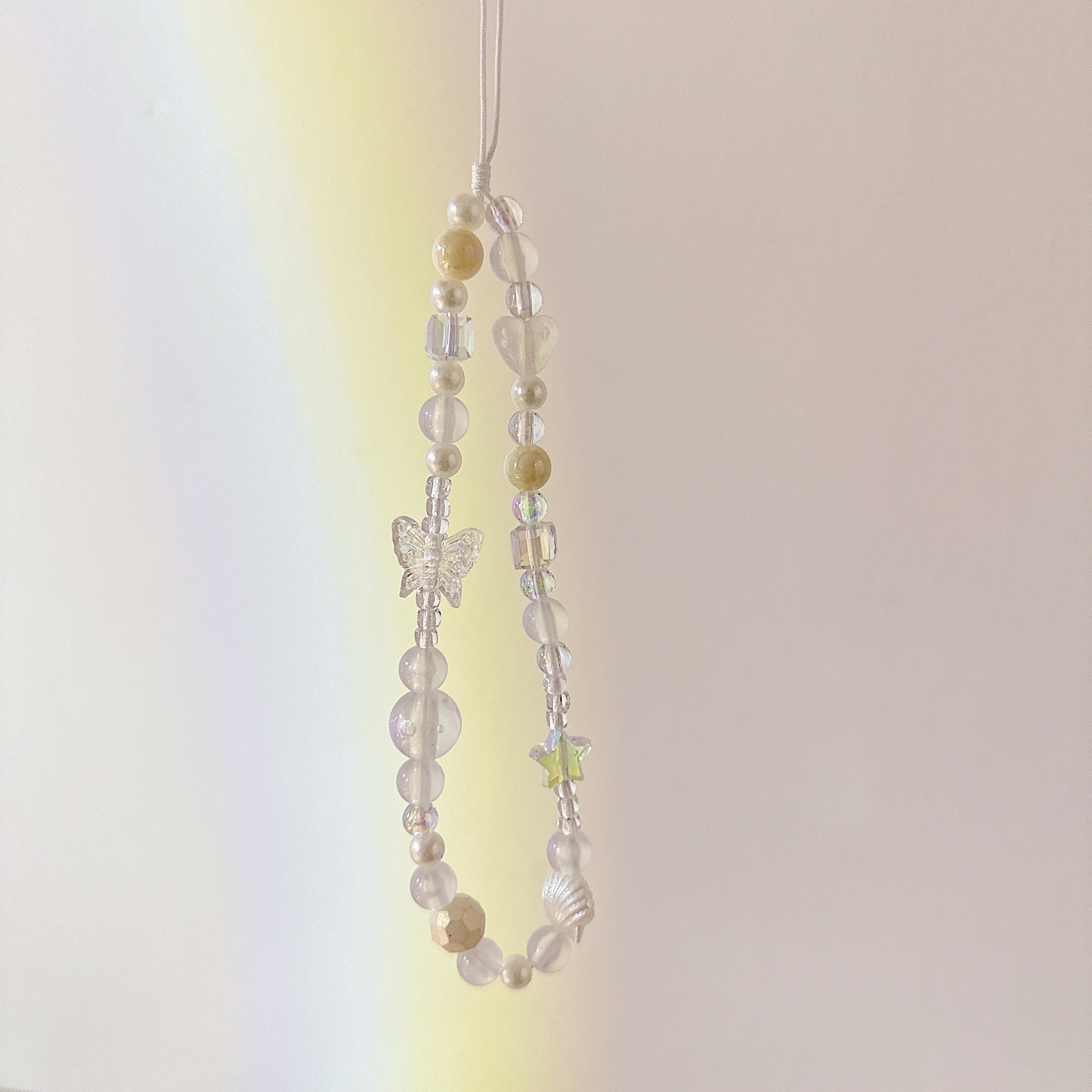 Cadena aplicable nicho mariposa corta cadena de muñeca arco cuentas de caso de teléfono móvil colgante tipo correa de muñeca anti-pérdida