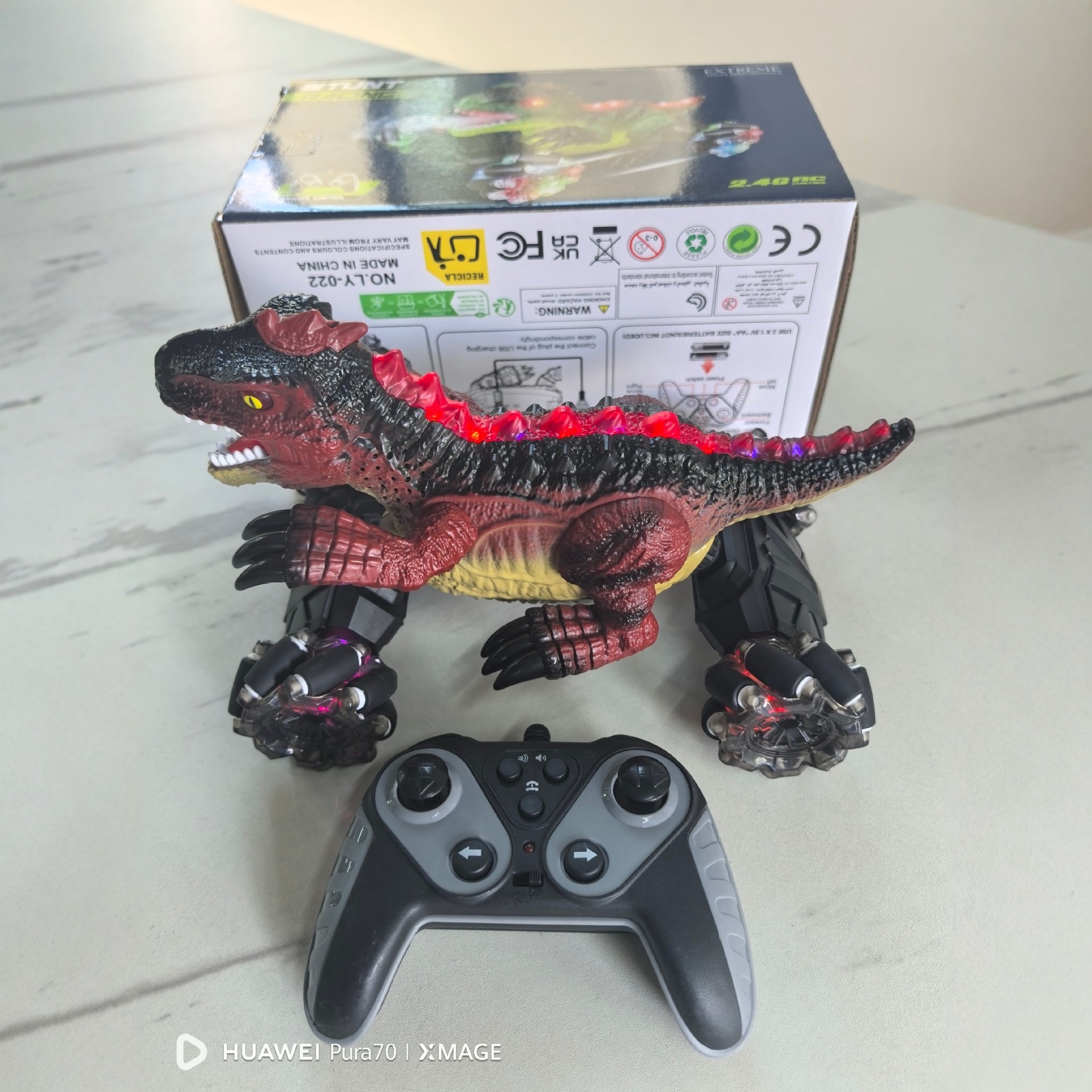 Transfronterizo 12 dinosaurios spray escalada truco de control remoto TK luz y sonido 360 deformación dinosaurios control remoto