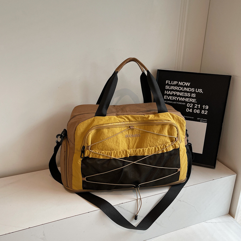 Nicho de diseño de moda moda moda bolsa de mano de mujer gran capacidad bolsa de viaje corto bolsa de almacenamiento bolsa de viaje deportiva al aire libre
